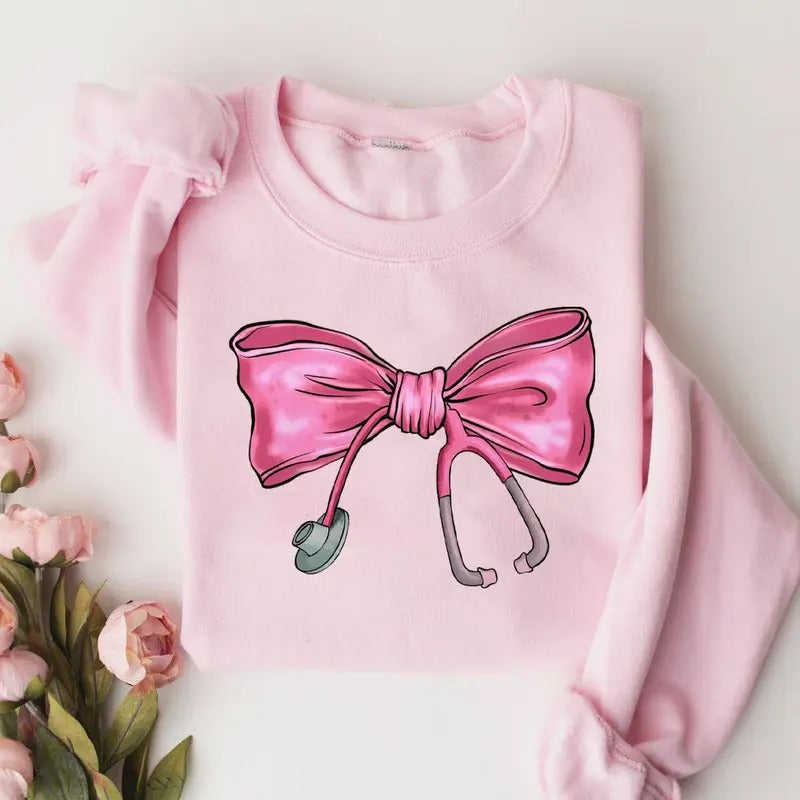 Coquette Nurse Stethoscope Bow Sweatshirt, Pink Bow Nurse Sweatshirt, Nurse Shirt, Gift for Nurse, ER RN Nurse...
