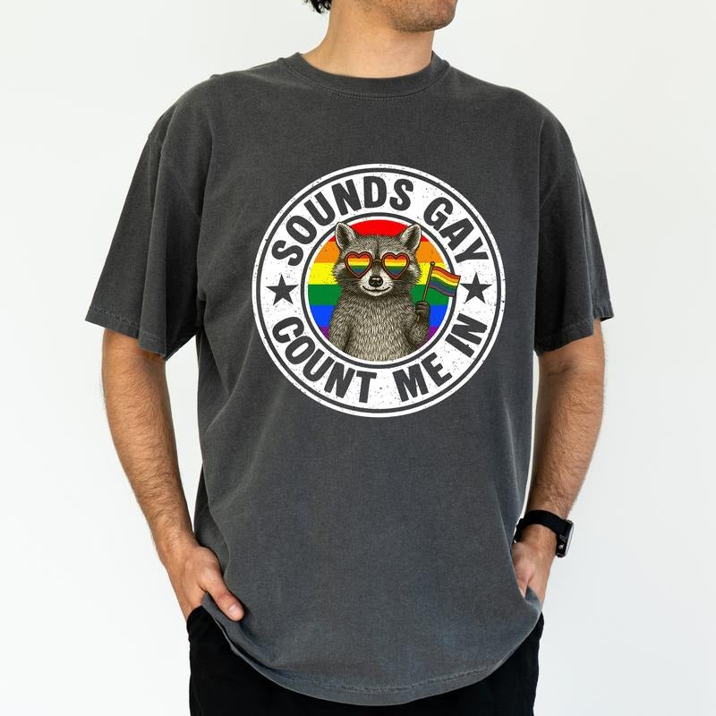 ChicCotton Sounds Gay Count Me In Comfort Colors Graphic Tee, Pride Month T-shirt For Men, Funny Raccoon Support LGBT...
