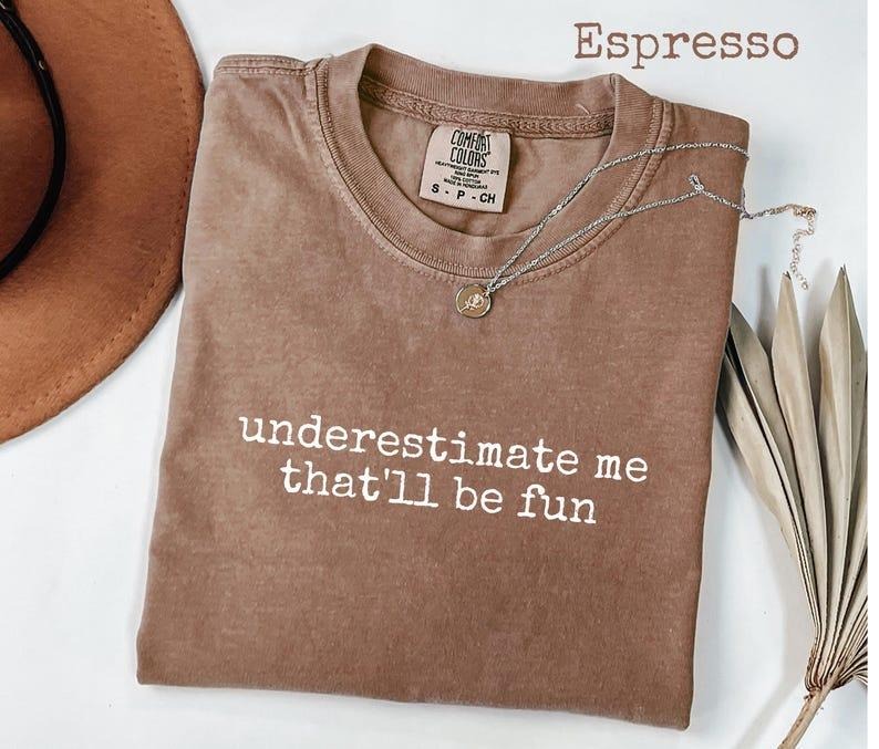 Comfort Colors Underestimate Me That'll Be Fun T-Shirt, Confident Sassy Graphic Tee for Women, Bold Girl Power Shirt,...
