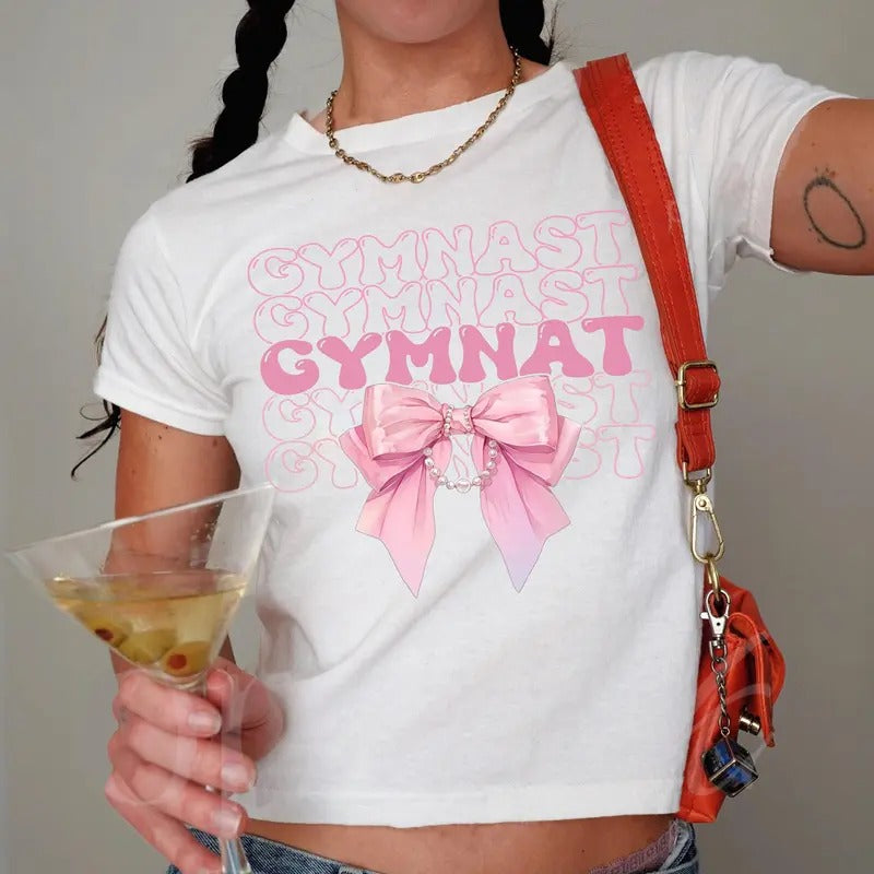 Coquette Gymnastics Baby Tee, Aesthetic Pink Bow Gymnast , Gymnast Team Gift for Athlete, Sports Lovers Tee, Trendy Gym...