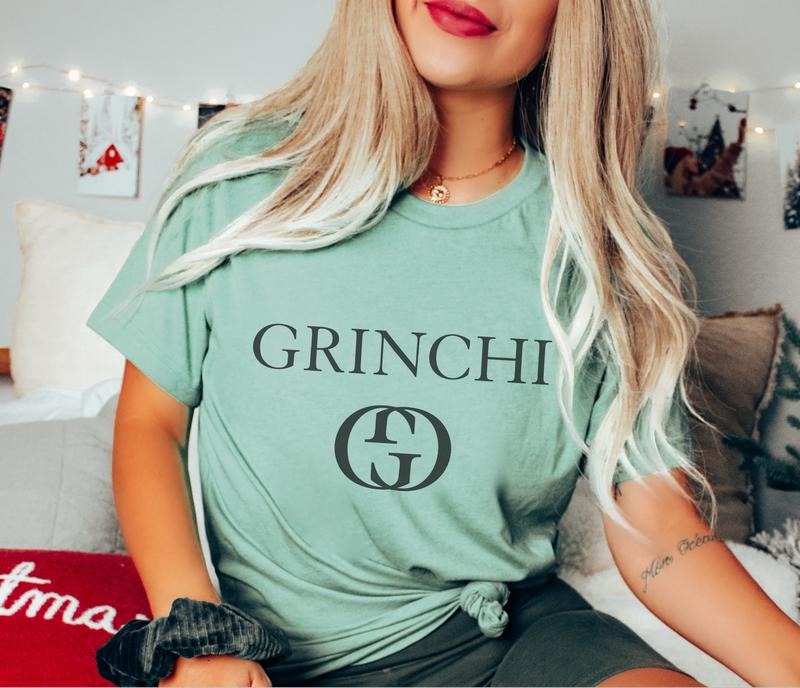 G is Grinchi Holiday T-Shirt Christmas Parody Designer Tshirt Snow Grinch Tee Bright Lights T-Shirt Grinchi Christmas Tee...