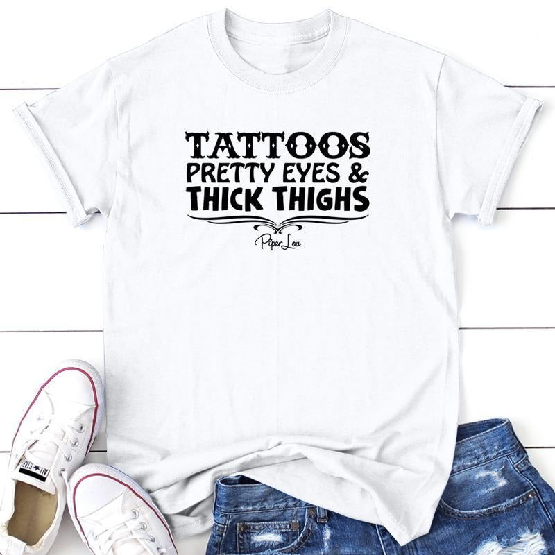 Tattoos Pretty Eyes And Thick Thighs Apparel, Proudly Printed In The USA, Tee / Tank / V Neck Gray / White / Blue / Hot...