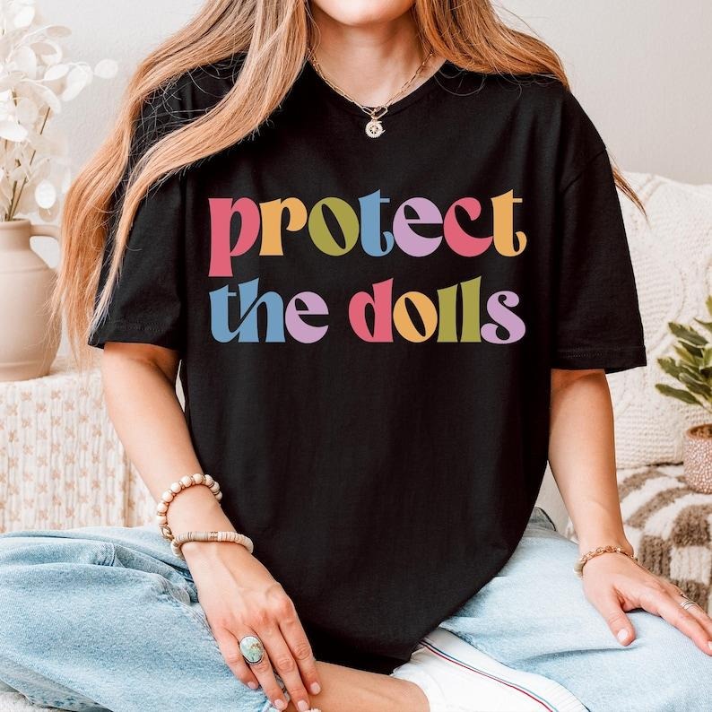 Protect The Dolls Shirt, Feminist T-Shirt, Gender Equality Shirt, Human Rights Activist Top, Short Sleeve Jersey Tee...