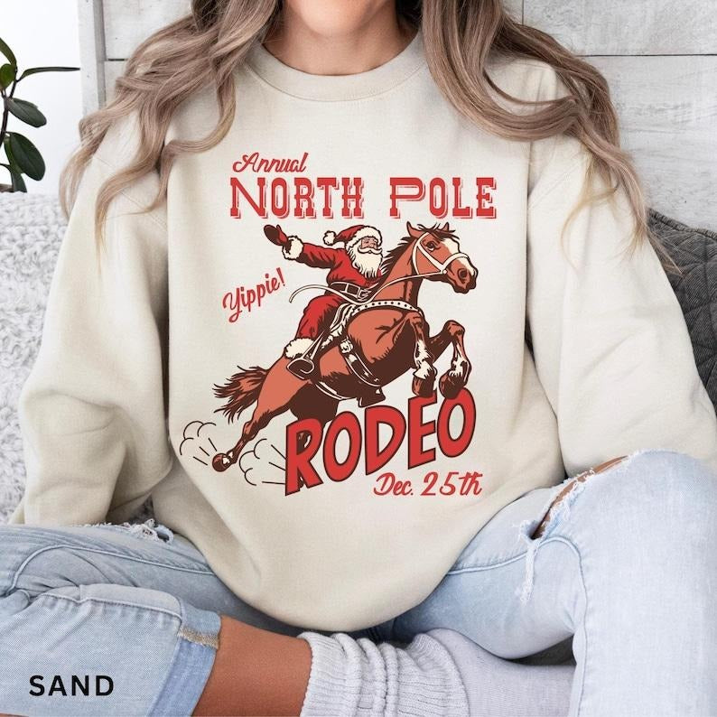 Retro Western Christmas Sweatshirt, North Pole Rodeo Sweatshirt, Trendy Western Holiday Shirt, Cute Country Christmas...