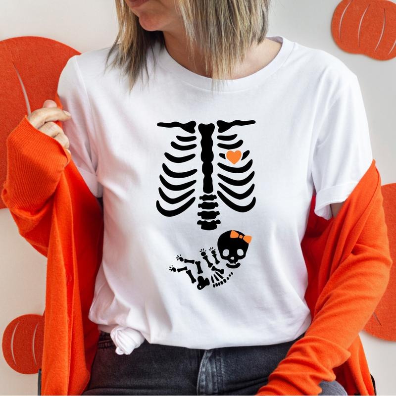 Skeleton Maternity Halloween T-Shirt, Girl Pregnancy Announcement Shirt, New Mom To Be Tee, Pregnant Wife Gift Tee...