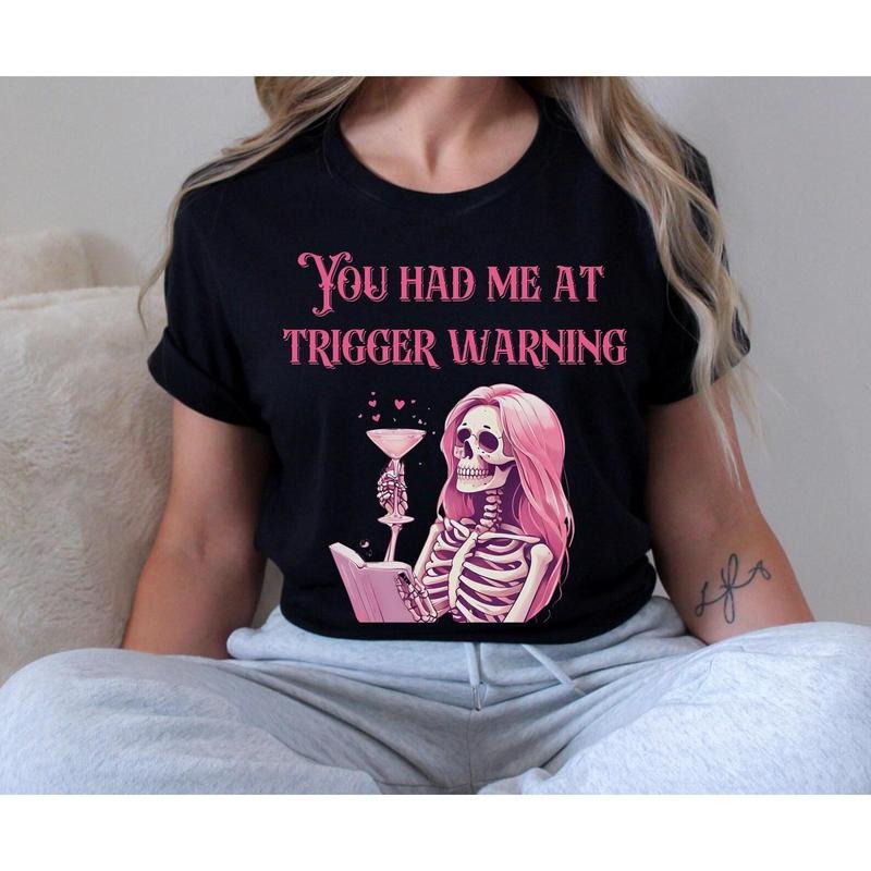 TRIGGER WARNING Sassy Skeleton Tee, Dark Romance Shirt, Gift for Her, Casual Wear, Unique Graphic Tee for Readers Hoodie,...