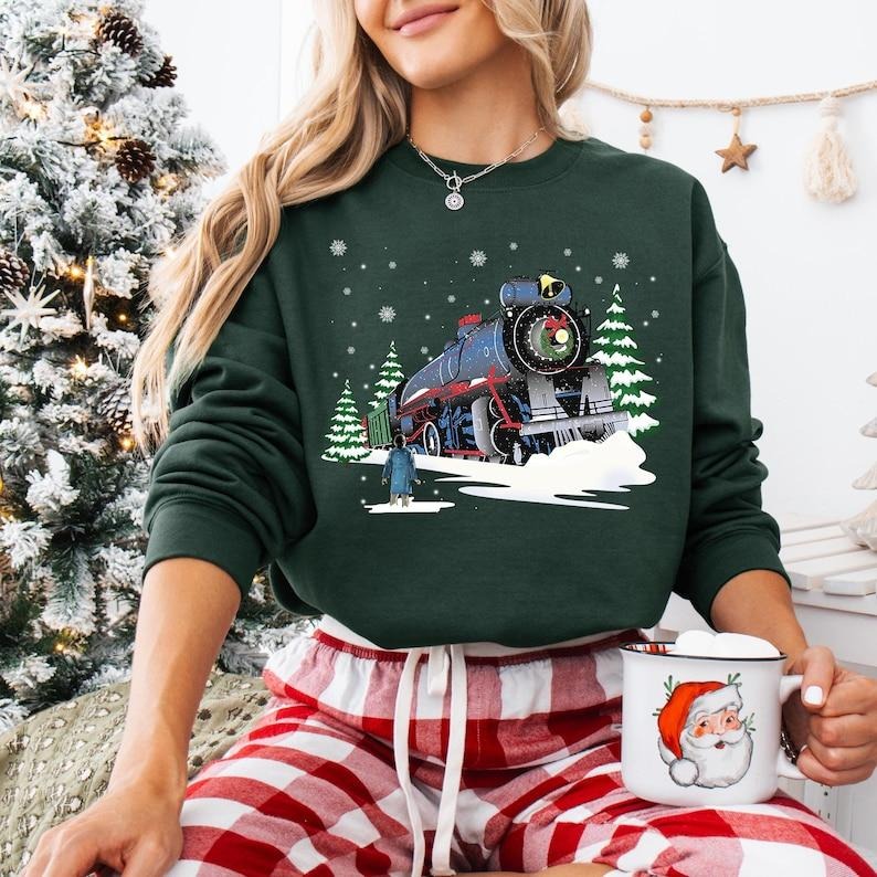 The Polar Express Christmas Sweatshirt, North Pole Christmas T-shirt, Believe Christmas Tee, All Aboard Admit One Hoodie,...