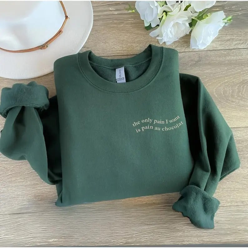 The only pain I want is pain au chocolat oversize sweater green Pinterest trendy aesthetic winter warm quote cozy hoodie...