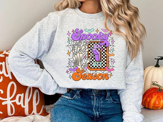 Women's Gildan Spooky Season Sweatshirt with Skeleton Hand Turning On & Off Light Switch, Cute Halloween Sweatshirt,...